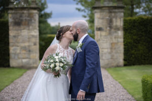 bride and groom in the stunning gardens of hoar Cross Hall