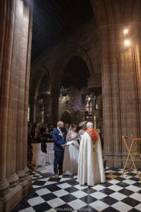 Hoar Cross Hall Wedding church bride and groom exchanging vows bride story rings ceremony