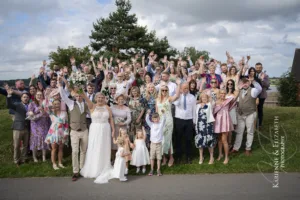 An epic wedding photograph of the entire wedding party at Blithfield Lakeside Barns.