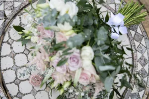 The close up of the wedding rings photographed with the beautiful wedding flowers.